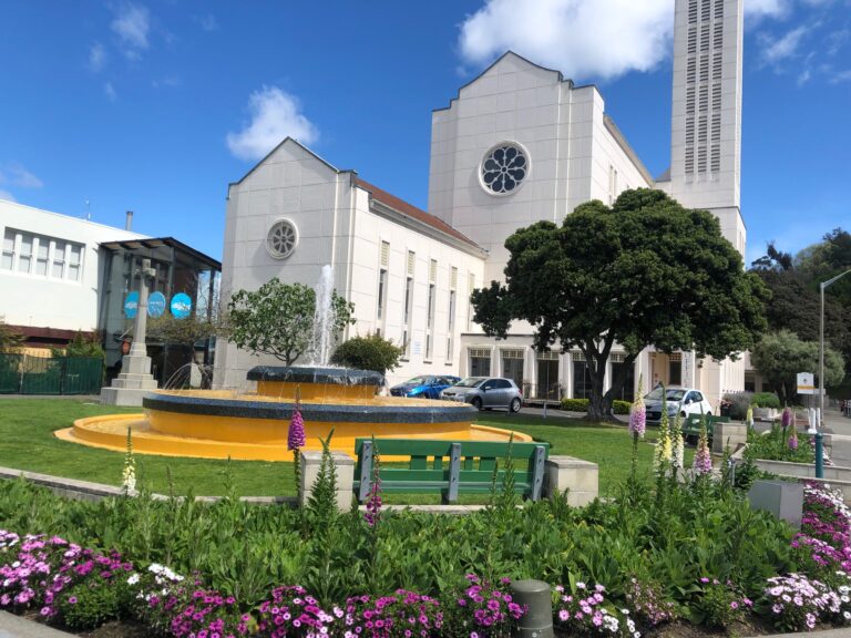 Waiapu Cathedral, with fountain and summer flowers